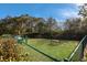 Fenced-in pet park with a waste disposal station at 7390 Divot Loop, Lakewood Ranch, FL 34202