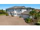 Two-story home with attached garage and landscaped grounds at 7390 Divot Loop, Lakewood Ranch, FL 34202