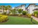 Two-story home with lush landscaping and brick driveway at 7390 Divot Loop, Lakewood Ranch, FL 34202