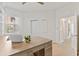 Bright home office with built-in shelving and a large desk at 7390 Divot Loop, Lakewood Ranch, FL 34202