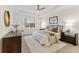 Main bedroom with plush bedding and stylish decor at 7390 Divot Loop, Lakewood Ranch, FL 34202