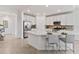 Modern kitchen with white cabinets, stainless steel appliances and an island at 7390 Divot Loop, Lakewood Ranch, FL 34202