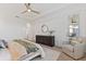 Main bedroom with a king-size bed and access to the patio at 7390 Divot Loop, Lakewood Ranch, FL 34202