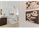 Spacious bedroom with plush bedding and large window at 7390 Divot Loop, Lakewood Ranch, FL 34202