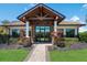 Community clubhouse entrance with stone accents at 7390 Divot Loop, Lakewood Ranch, FL 34202