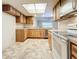 Kitchen with light wood cabinets and appliances at 2587 Countryside Blvd # 6111, Clearwater, FL 33761