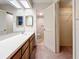 Bathroom with double vanity and access to a toilet and closet at 2587 Countryside Blvd # 6111, Clearwater, FL 33761