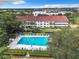 Community pool with surrounding patio furniture at 2587 Countryside Blvd # 6111, Clearwater, FL 33761