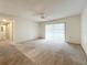 Spacious bedroom featuring carpet flooring and sliding glass doors at 2587 Countryside Blvd # 6111, Clearwater, FL 33761