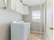 Laundry room with washer, dryer, and cabinets at 3303 Pine Top Dr, Valrico, FL 33594