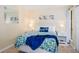 Bedroom with a comfortable bed and coastal decor at 6157 Midnight Pass Rd # A51, Sarasota, FL 34242