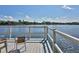 Private dock with seating, offering scenic waterfront views at 6157 Midnight Pass Rd # A51, Sarasota, FL 34242