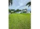 Expansive green lawn with a side view of the house at 7602 San Juan Ave, Bradenton, FL 34209