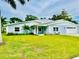 Newly renovated light blue house with a large green yard at 7602 San Juan Ave, Bradenton, FL 34209