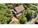 Aerial view of a house nestled among trees near a road at 1332 3Rd W Ave, Bradenton, FL 34205