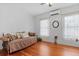 Relaxing bedroom with daybed, hardwood floors and bright windows at 1332 3Rd W Ave, Bradenton, FL 34205