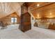 Spacious bonus room with wood ceiling, brick fireplace, and comfortable seating at 1332 3Rd W Ave, Bradenton, FL 34205