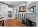 Kitchen features white cabinets, hardwood floors, and a built-in fireplace at 1332 3Rd W Ave, Bradenton, FL 34205