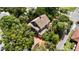 Stunning aerial view of a two-story house with lush landscaping at 1332 3Rd W Ave, Bradenton, FL 34205