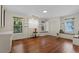 Common area with hardwood floors, built-in window seat, and white walls at 1332 3Rd W Ave, Bradenton, FL 34205