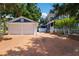 Two-car garage with concrete driveway and charming exterior at 1332 3Rd W Ave, Bradenton, FL 34205
