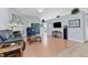 Living room features hardwood floors, fireplace and access to lanai at 6935 Arbor Oaks Cir, Bradenton, FL 34209