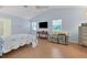 Main bedroom with hardwood floors and ensuite bathroom at 6935 Arbor Oaks Cir, Bradenton, FL 34209