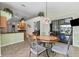 Bright kitchen with breakfast nook and access to backyard at 6935 Arbor Oaks Cir, Bradenton, FL 34209