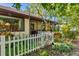 Charming backyard with white picket fence and lush landscaping at 6935 Arbor Oaks Cir, Bradenton, FL 34209