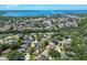 Aerial view of waterfront community with lush landscaping and numerous homes at 6935 Arbor Oaks Cir, Bradenton, FL 34209