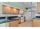 Kitchen boasts ample cabinetry, granite counters and stainless steel appliances at 6935 Arbor Oaks Cir, Bradenton, FL 34209