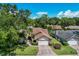 Single-Gathering home with a two-car garage and a well-manicured lawn at 6935 Arbor Oaks Cir, Bradenton, FL 34209