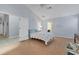 Bright bedroom with hardwood floors and ample space for furniture at 6935 Arbor Oaks Cir, Bradenton, FL 34209