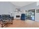 Living room with hardwood floors, fireplace and sliding doors to lanai at 6935 Arbor Oaks Cir, Bradenton, FL 34209