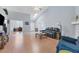 Bright living area with hardwood floors, view into office and high ceilings at 6935 Arbor Oaks Cir, Bradenton, FL 34209