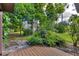 Landscaped backyard with lush greenery and stone fountain at 6935 Arbor Oaks Cir, Bradenton, FL 34209