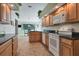 Kitchen features granite countertops, wood cabinets and island at 6935 Arbor Oaks Cir, Bradenton, FL 34209