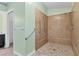 Large walk-in shower with grab bars and tiled floors at 6935 Arbor Oaks Cir, Bradenton, FL 34209