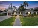 Two story home with landscaped yard, walkway, and updated exterior at 303 48Th W St, Bradenton, FL 34209