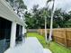 Fenced backyard with patio, grill and lush green grass at 303 48Th W St, Bradenton, FL 34209