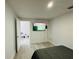 Bright bedroom with large TV and access to another room at 303 48Th W St, Bradenton, FL 34209