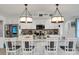 Modern kitchen with white cabinets and a large island at 303 48Th W St, Bradenton, FL 34209