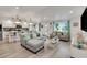 Bright living room with sectional sofa and large windows at 303 48Th W St, Bradenton, FL 34209