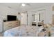 Bedroom with a queen bed, dresser, and mirrored closet doors at 303 48Th W St, Bradenton, FL 34209