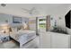 Bright bedroom with a king-size bed and a twin-size daybed, offering ample sleeping space at 303 48Th W St, Bradenton, FL 34209