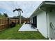 Private backyard with patio, grill and wooden fence at 303 48Th W St, Bradenton, FL 34209