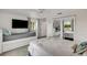 Spacious bedroom with a queen bed, twin daybed, and mirrored closet doors at 303 48Th W St, Bradenton, FL 34209