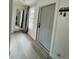 Inviting entryway with light flooring and a full-length mirror at 303 48Th W St, Bradenton, FL 34209