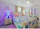 Bedroom with coastal decor, featuring a queen bed and mirrored closet at 303 48Th W St, Bradenton, FL 34209