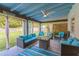 Covered patio with seating area, offering a relaxing outdoor space at 303 48Th W St, Bradenton, FL 34209